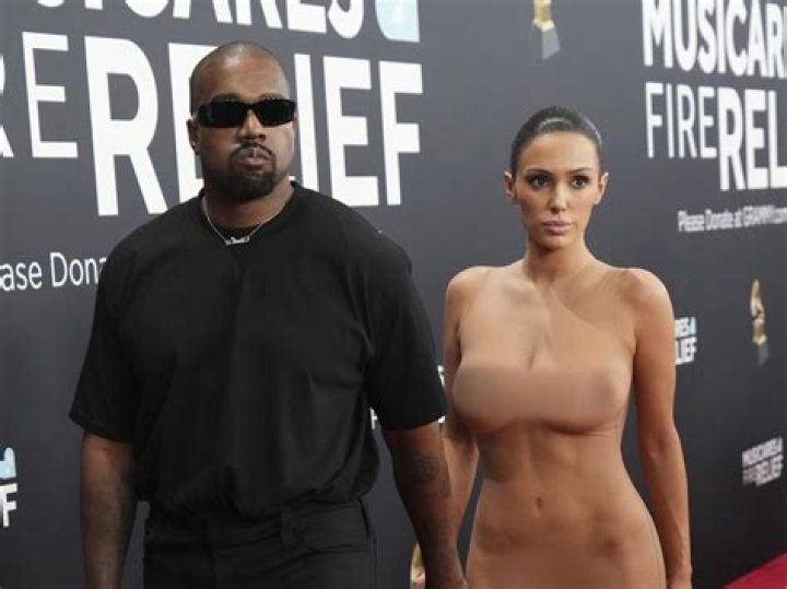 Kanye West's 'girlfriend' Vinetria shows off cleavage in dress after rapper shares pic of him kissin